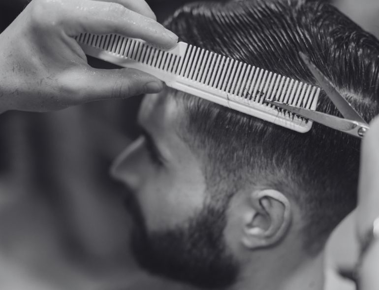 Messy Textured Pompadour with High Skin Fade: Bold Volume Meets Sharp